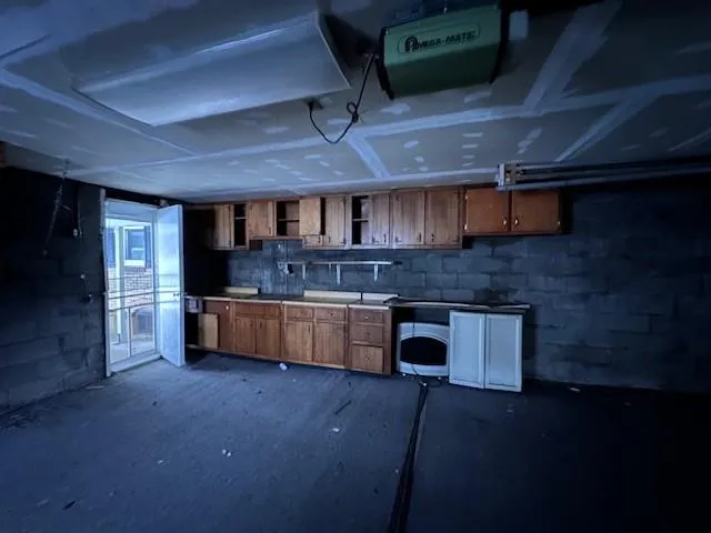 a kitchen with stainless steel appliances wooden cabinets a sink and a stove