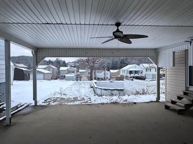 a room with water heater and a wooden floor
