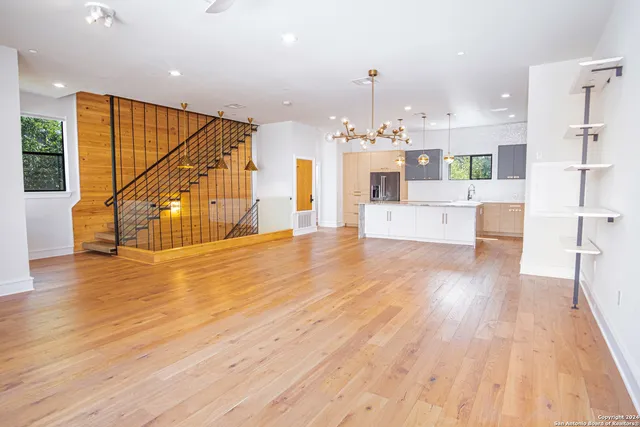 a view of kitchen living room with wooden floor