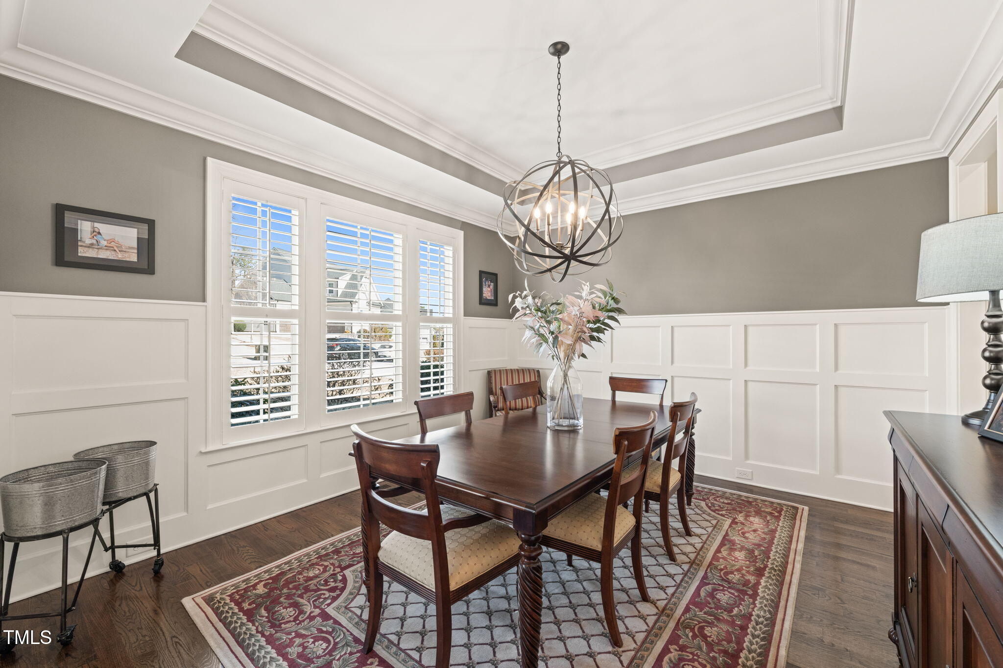 1301 Mackinaw Drive Wake Forest, NC 27587 - Photo 11 of 55 a view of a dining room with furniture a chandelier and wooden floor