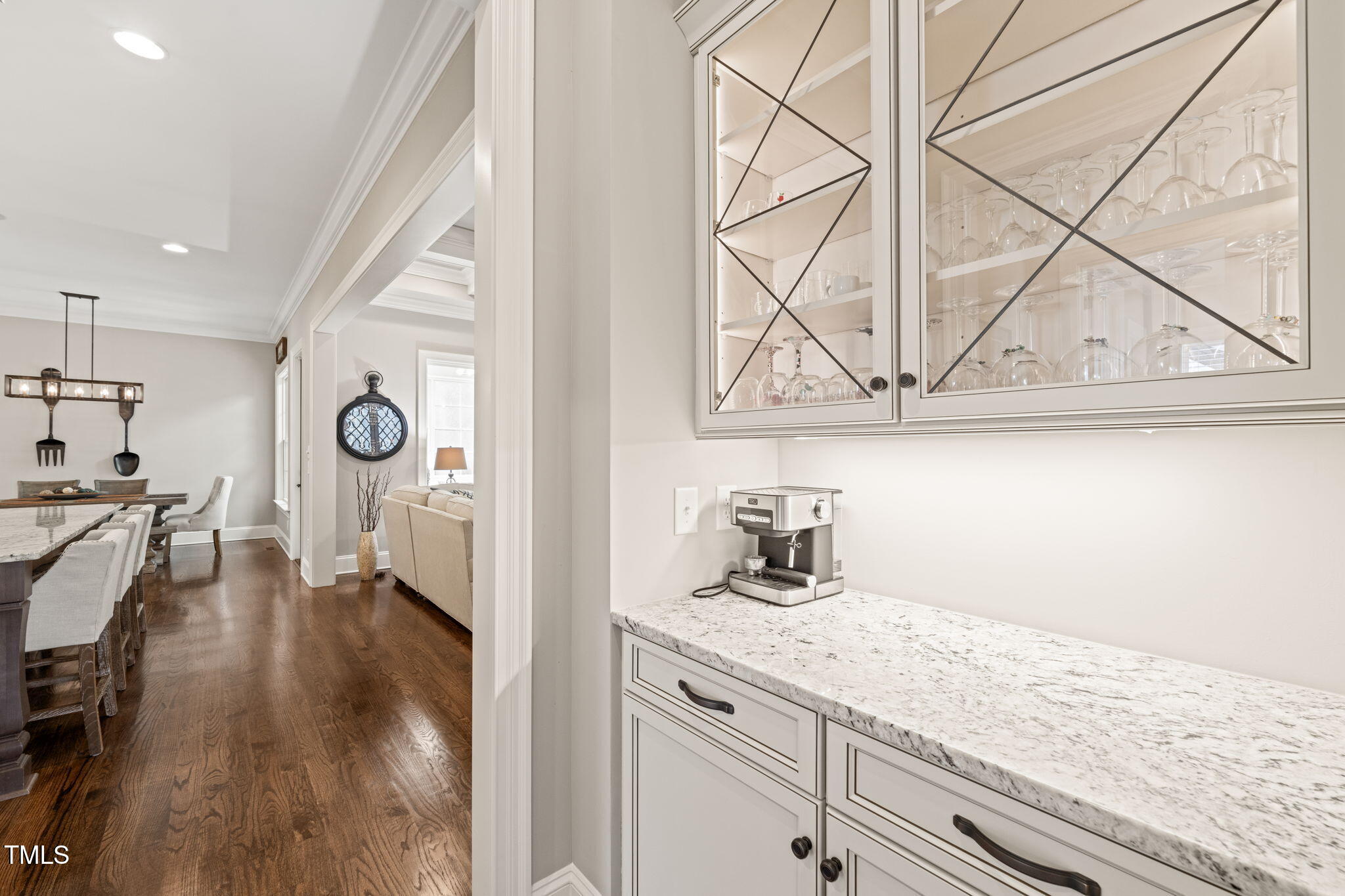 1301 Mackinaw Drive Wake Forest, NC 27587 - Photo 16 of 55 a hallway with sink and mirror with wooden floor