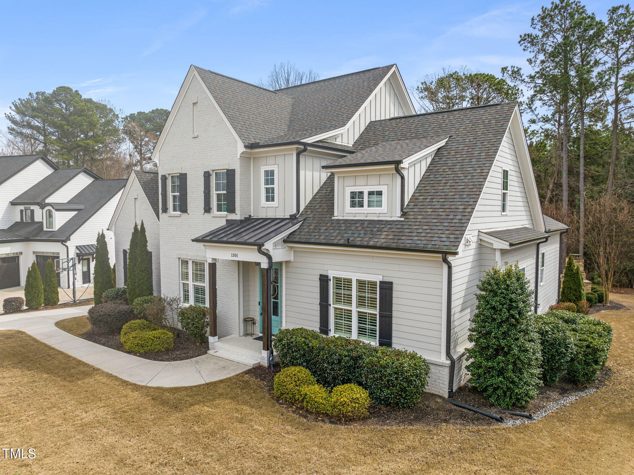 1301 Mackinaw Drive Wake Forest, NC 27587 - Photo 2 of 55 a view of a white house next to a yard
