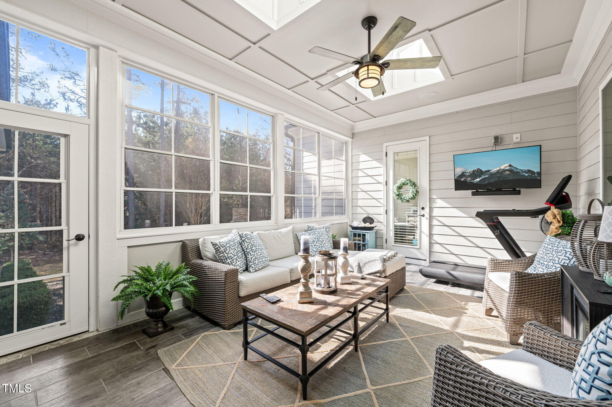 1301 Mackinaw Drive Wake Forest, NC 27587 - Photo 22 of 55 a living room with furniture a flat screen tv and a large window