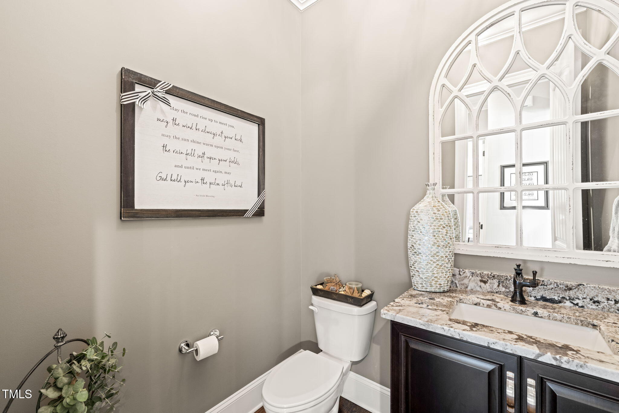 1301 Mackinaw Drive Wake Forest, NC 27587 - Photo 25 of 55 a bathroom with a toilet sink and mirror