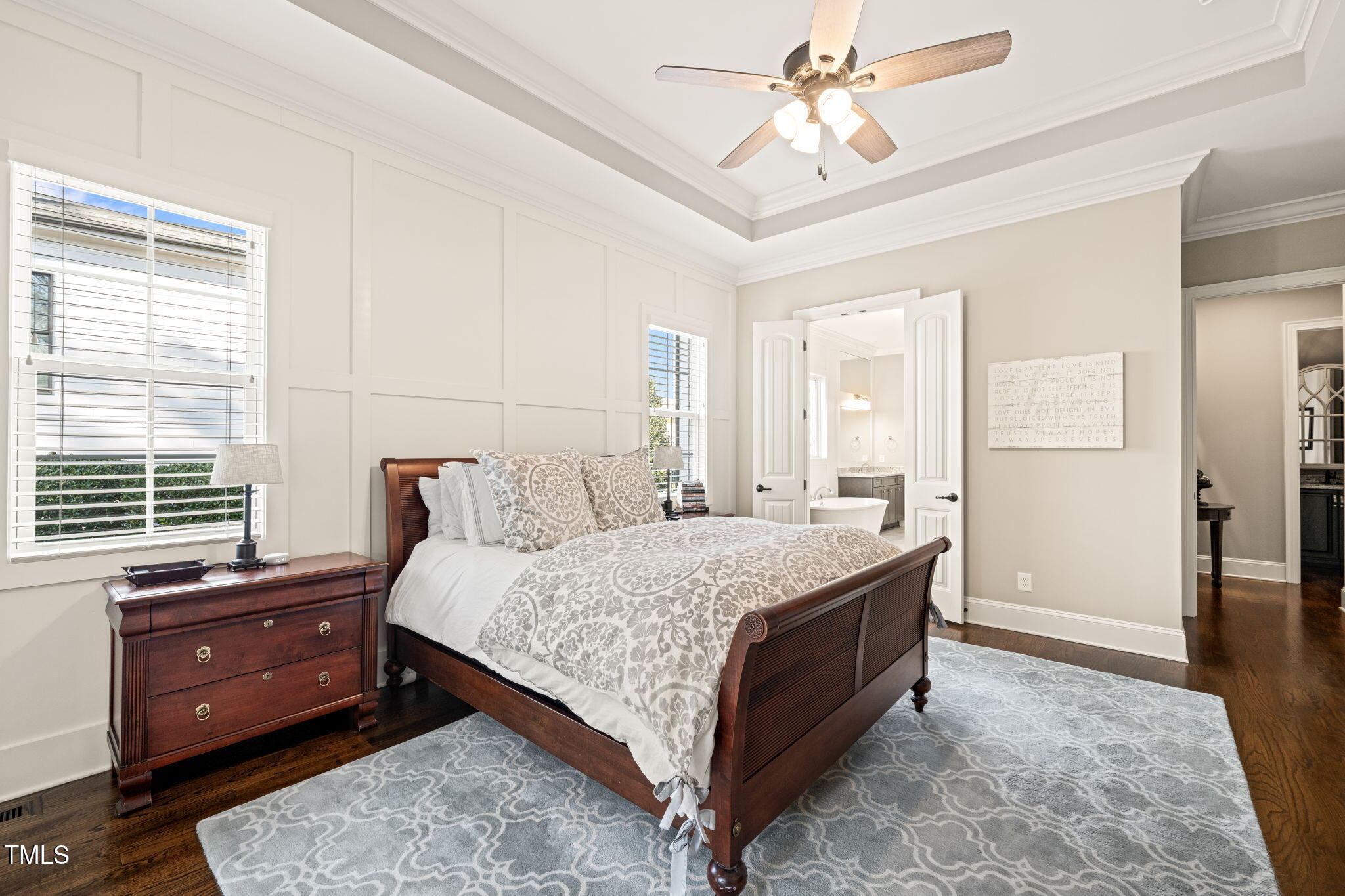 1301 Mackinaw Drive Wake Forest, NC 27587 - Photo 27 of 55 a bedroom with a bed and a chandelier