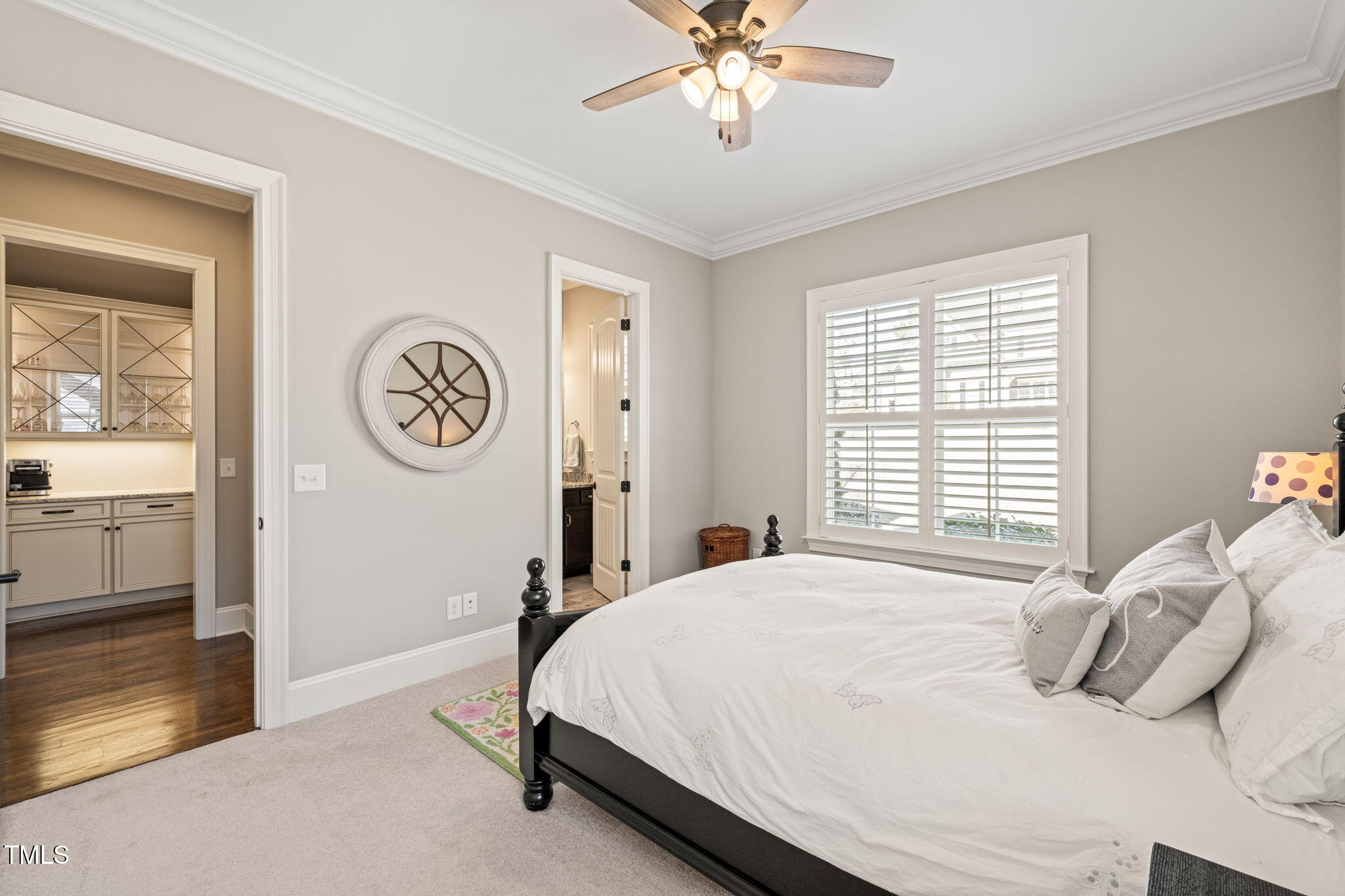 1301 Mackinaw Drive Wake Forest, NC 27587 - Photo 33 of 55 a bedroom with a bed and a chandelier