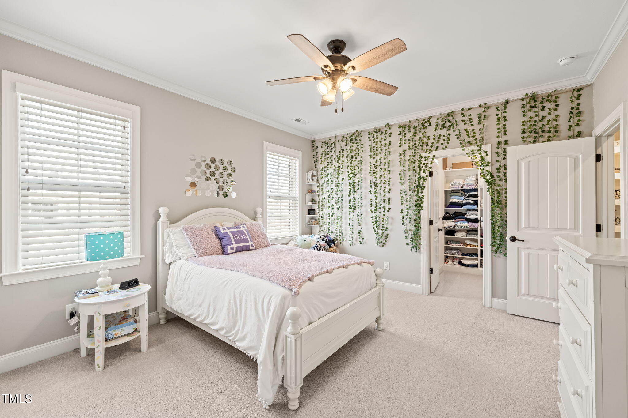 1301 Mackinaw Drive Wake Forest, NC 27587 - Photo 37 of 55 a bedroom with a large bed and a chandelier