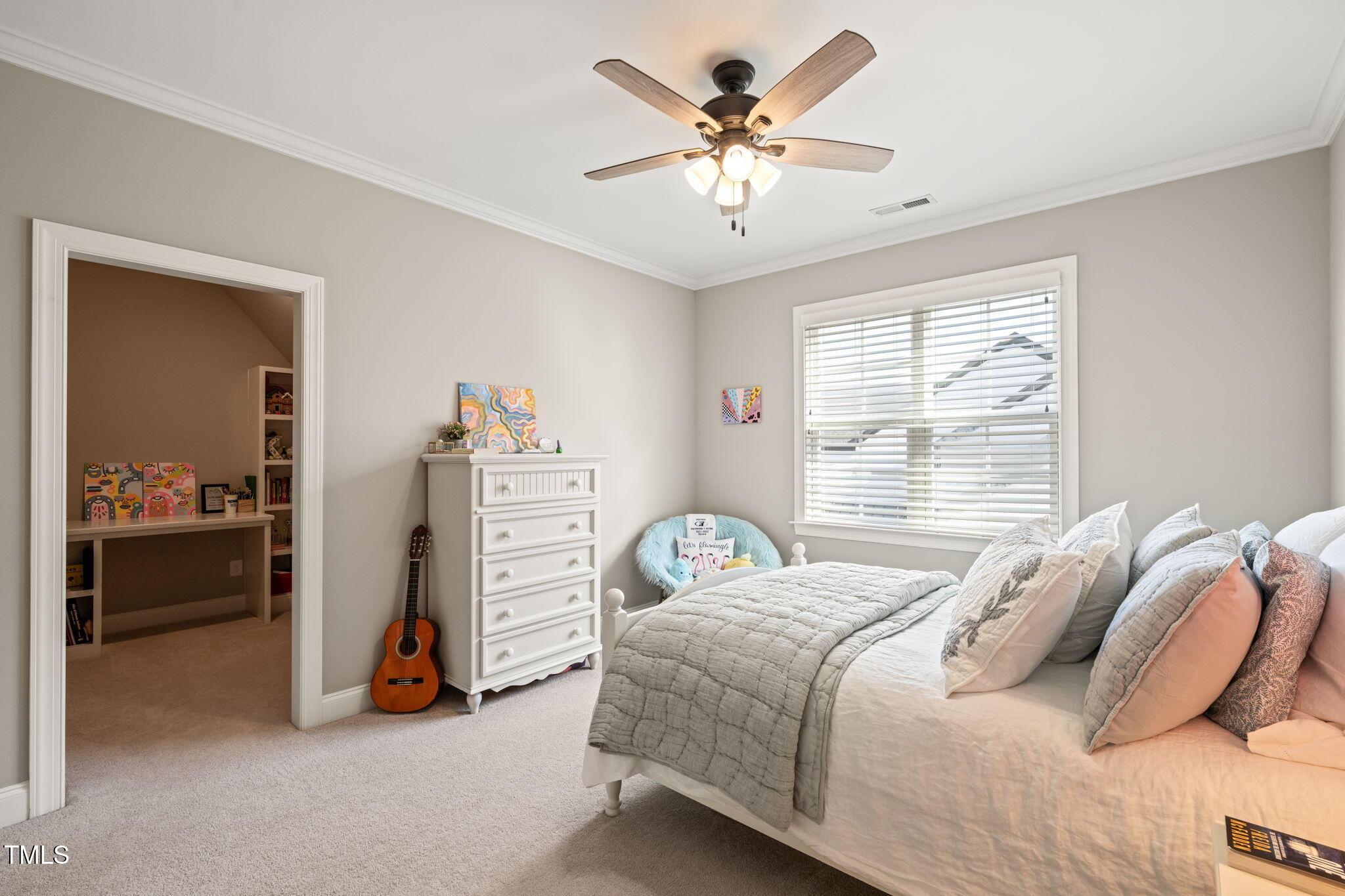 1301 Mackinaw Drive Wake Forest, NC 27587 - Photo 41 of 55 a bedroom with a bed a couch and a chandelier