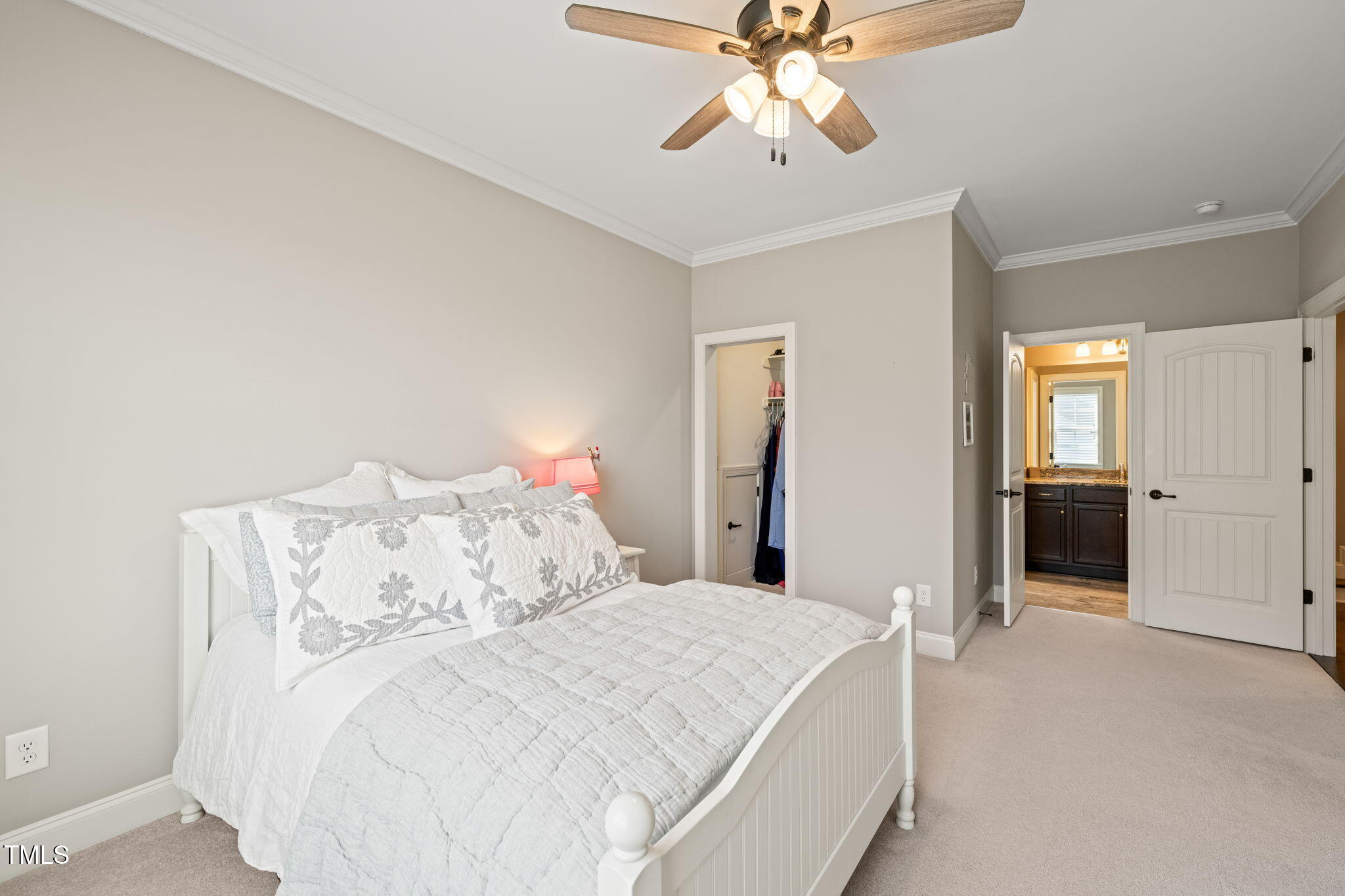 1301 Mackinaw Drive Wake Forest, NC 27587 - Photo 42 of 55 a bedroom with a bed and a chandelier