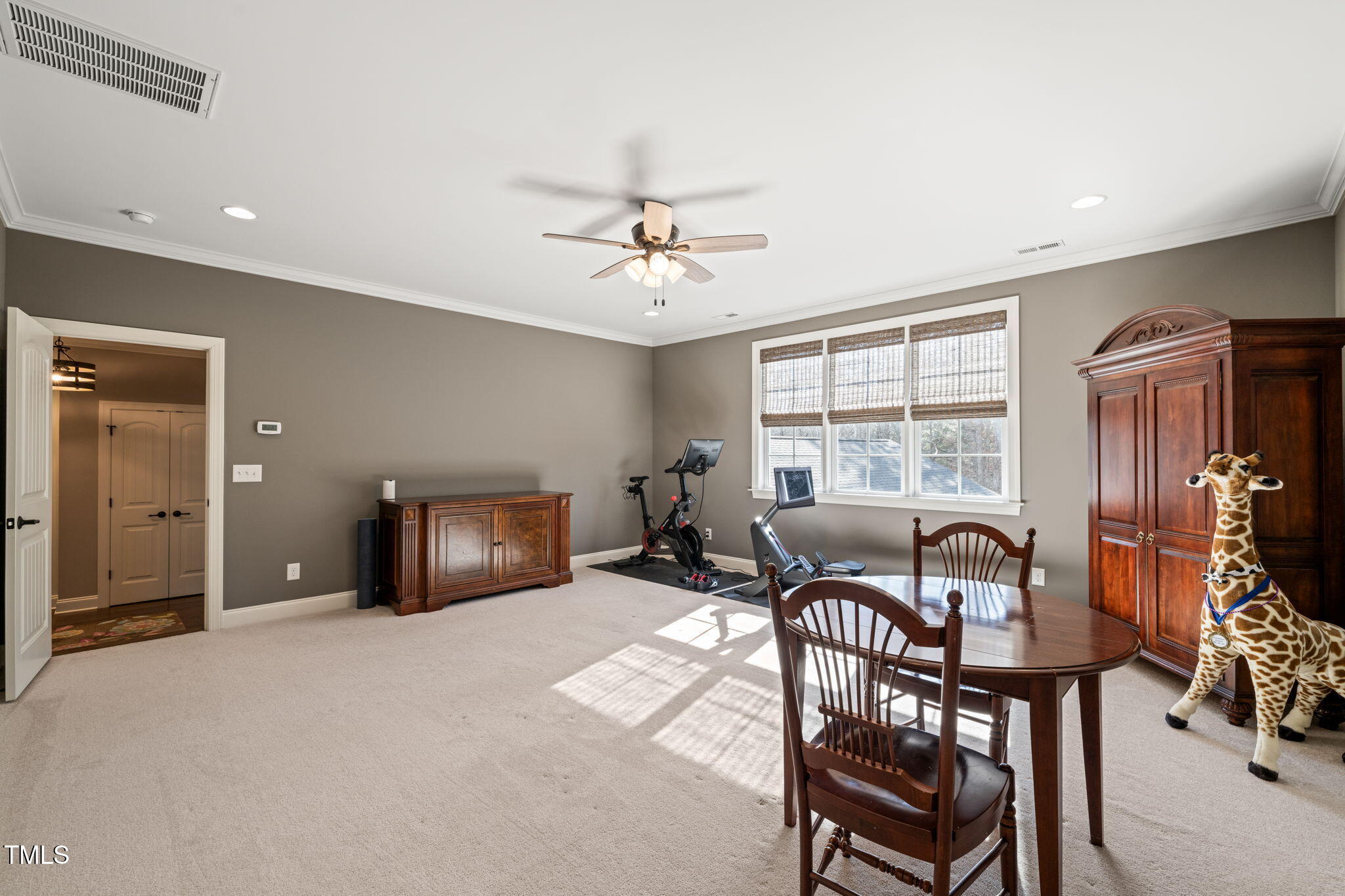 1301 Mackinaw Drive Wake Forest, NC 27587 - Photo 46 of 55 a living room with furniture a chandelier and a window