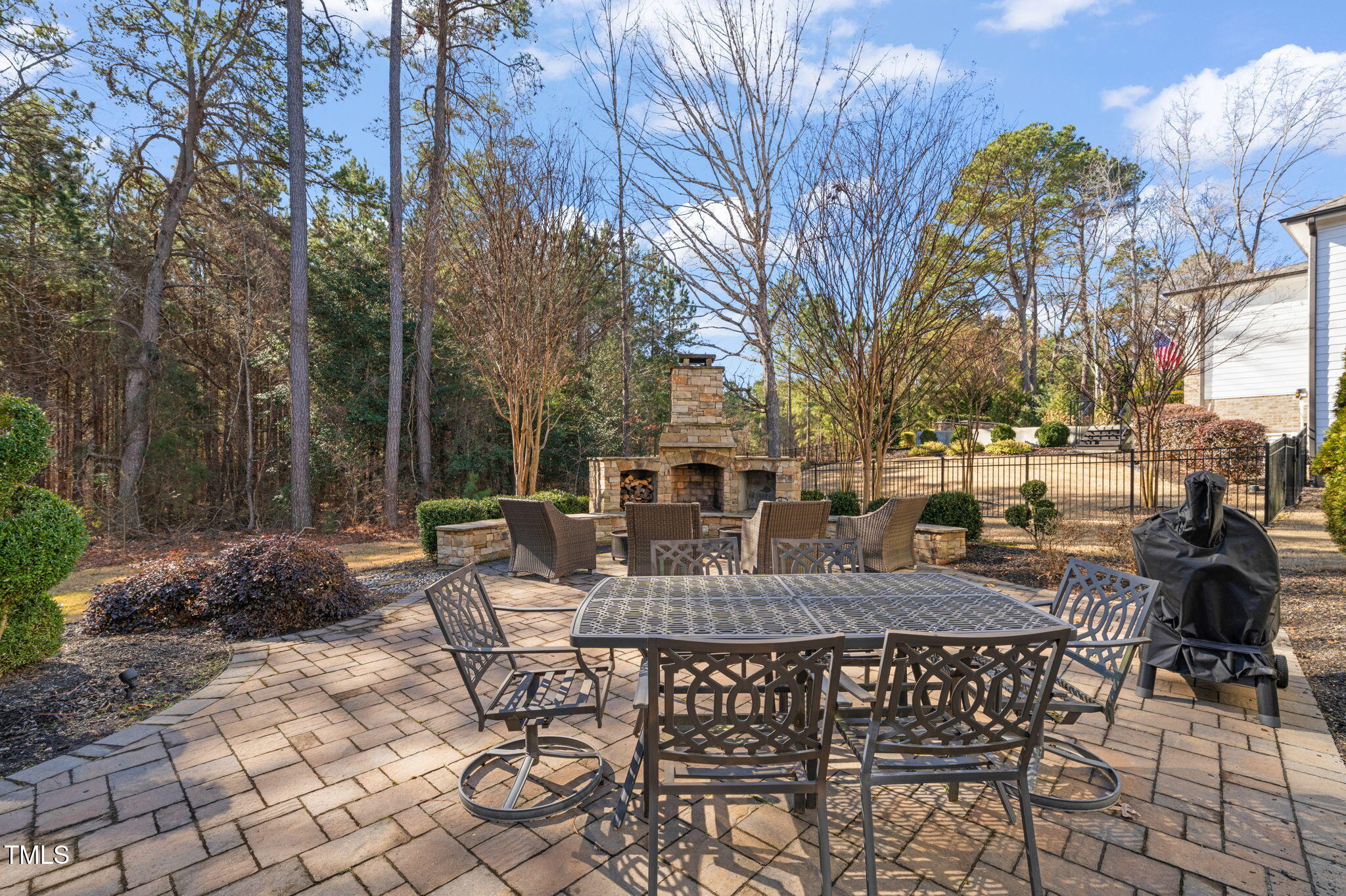 1301 Mackinaw Drive Wake Forest, NC 27587 - Photo 47 of 55 a view of a patio with a table and chairs