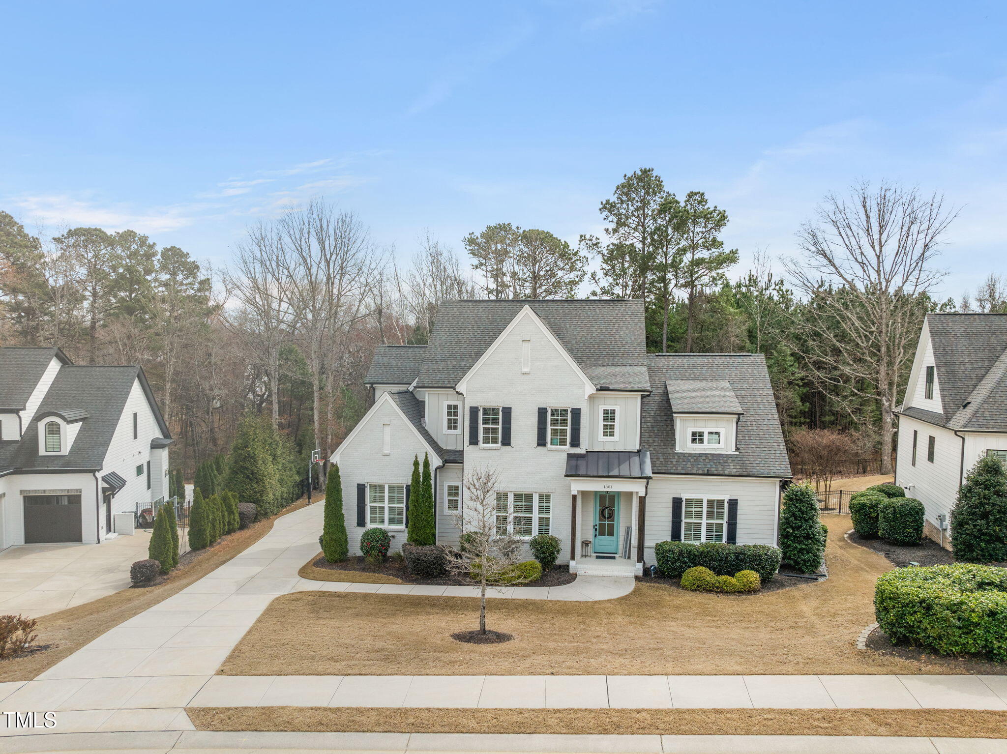 1301 Mackinaw Drive Wake Forest, NC 27587 - Photo 7 of 55 a front view of a house with a garden