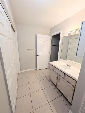 a room with a washing machine and a sink