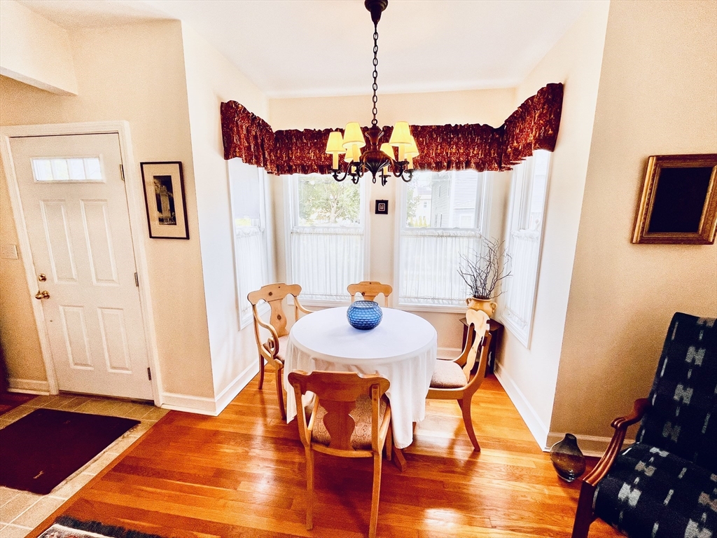 16 Pleasant Street Hamilton, MA 01982 - Photo 4 of 16 a view of a dining room with furniture and wooden floor
