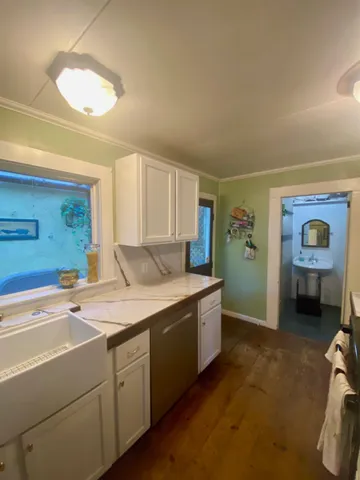 a room with furniture and a wooden floor