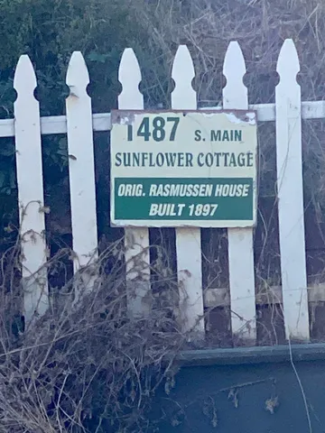 a sign that is on the side of the building