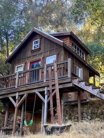 a room with furniture pool table and windows