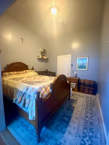 a bathroom with a granite countertop sink and a bathtub