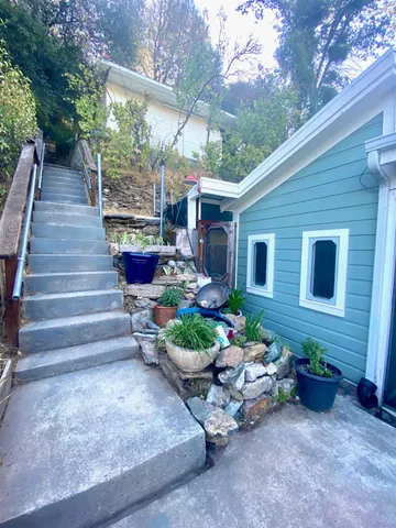 a view of a backyard with sitting area