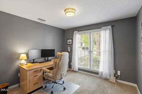 a view of a workspace with furniture