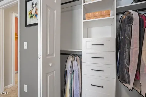 a bathroom with a toilet a sink and curtain