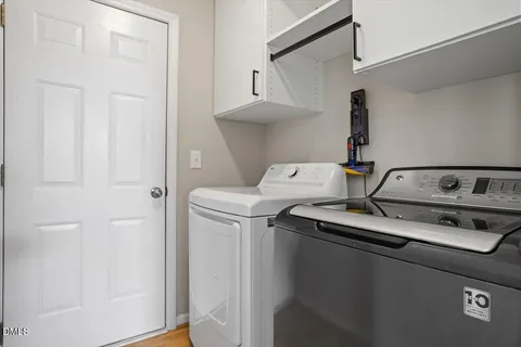 a house that has a tree in front of the house