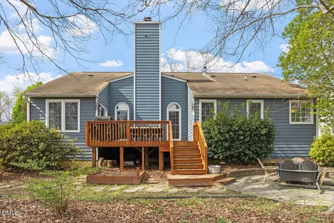 a view of a backyard with sitting area