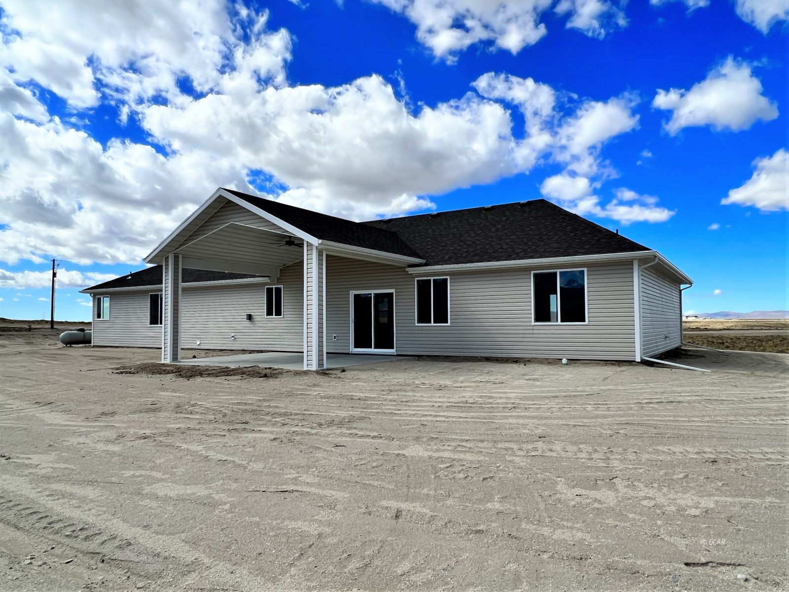 200 Ridgeway Drive Spring Creek, NV 89815 - Photo 32 of 34 a house with trees in the background