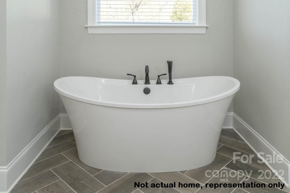 L47 Kiser Island Road Terrell, NC 28682 - Photo 29 of 48 a white bath tub sitting in a bathroom