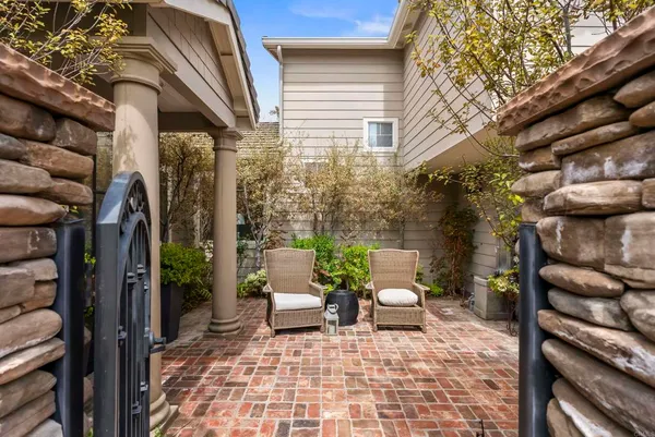a view of a patio with a chairs and table in a patio