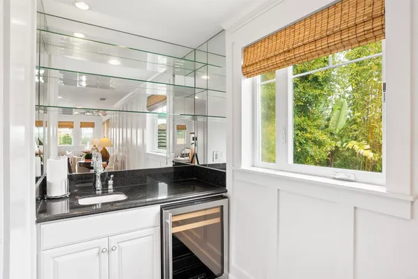 a kitchen with a sink and large window