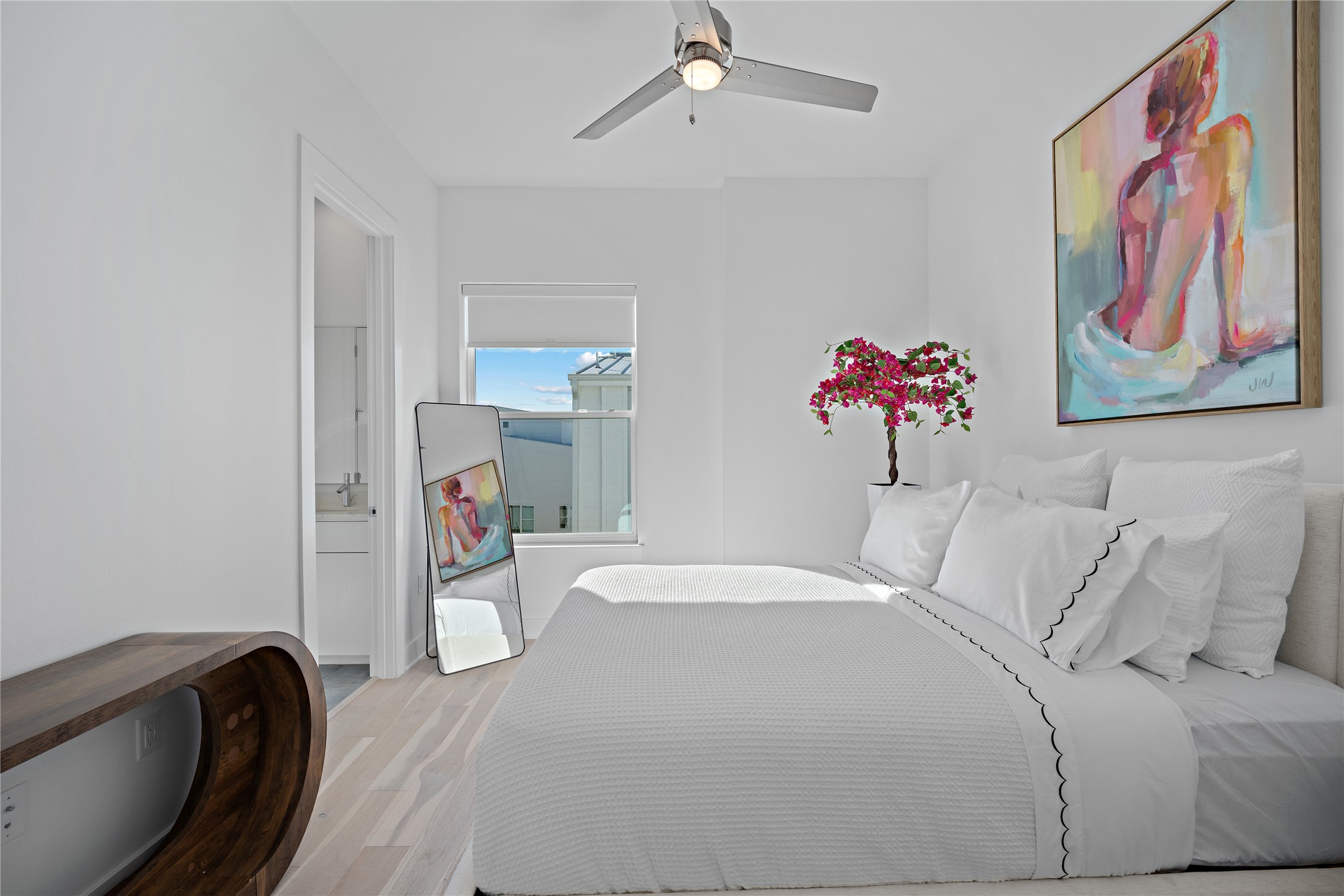 2805 McCurdy Street, Unit 6 Austin, TX 78723 - Photo 26 of 38 a bedroom with a bed and a painting on the wall