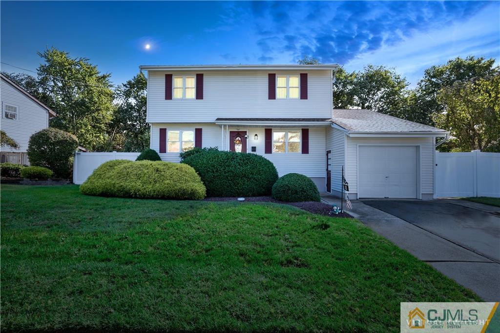 55 Gramercy Road Old Bridge, NJ 08857 - Photo 1 of 22 a front view of a house with a yard and garage