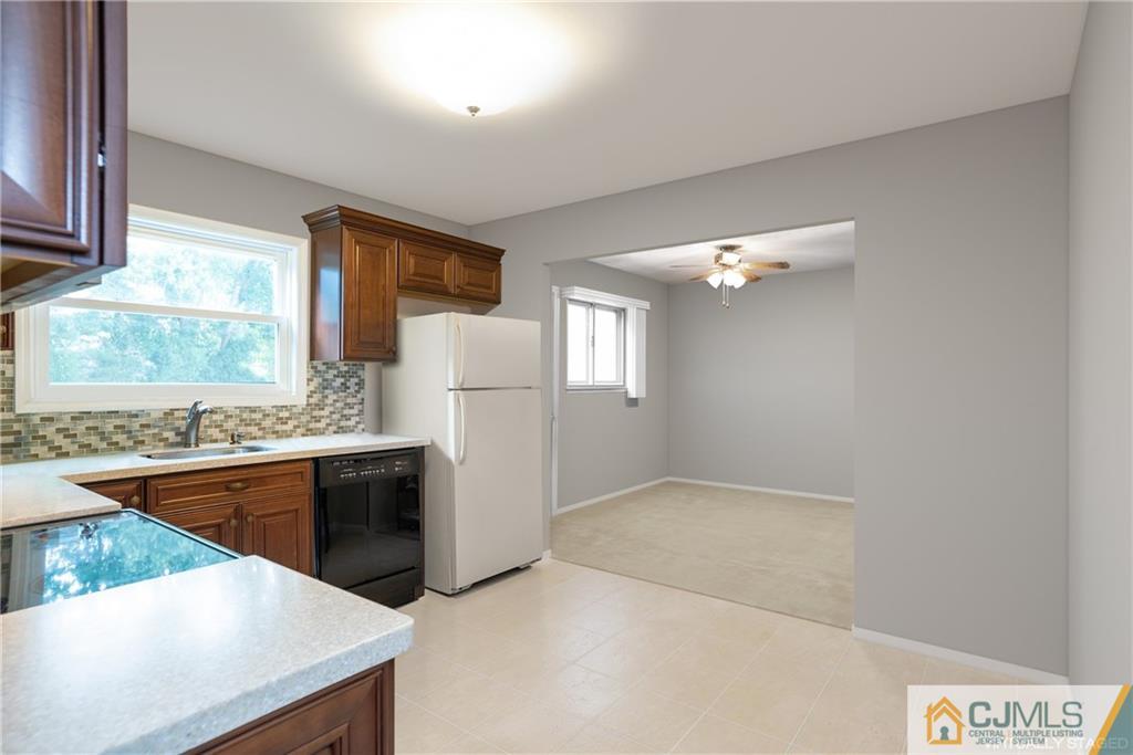 55 Gramercy Road Old Bridge, NJ 08857 - Photo 13 of 22 a kitchen with a cabinets and white appliances