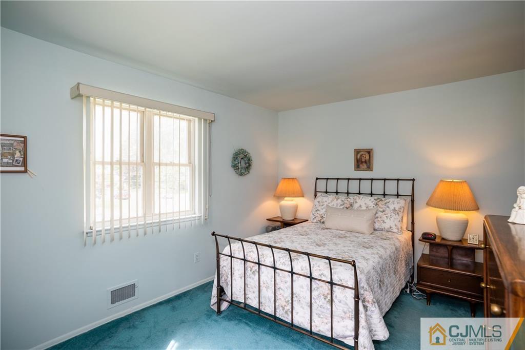 55 Gramercy Road Old Bridge, NJ 08857 - Photo 14 of 22 a bedroom with a bed and window