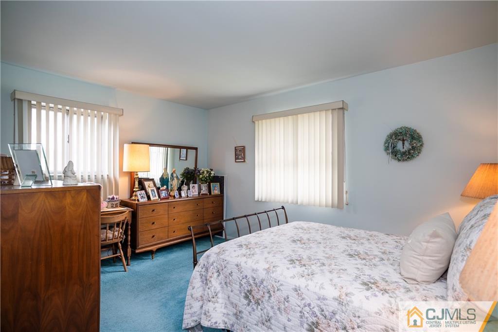 55 Gramercy Road Old Bridge, NJ 08857 - Photo 15 of 22 a bed room with a bed and a window