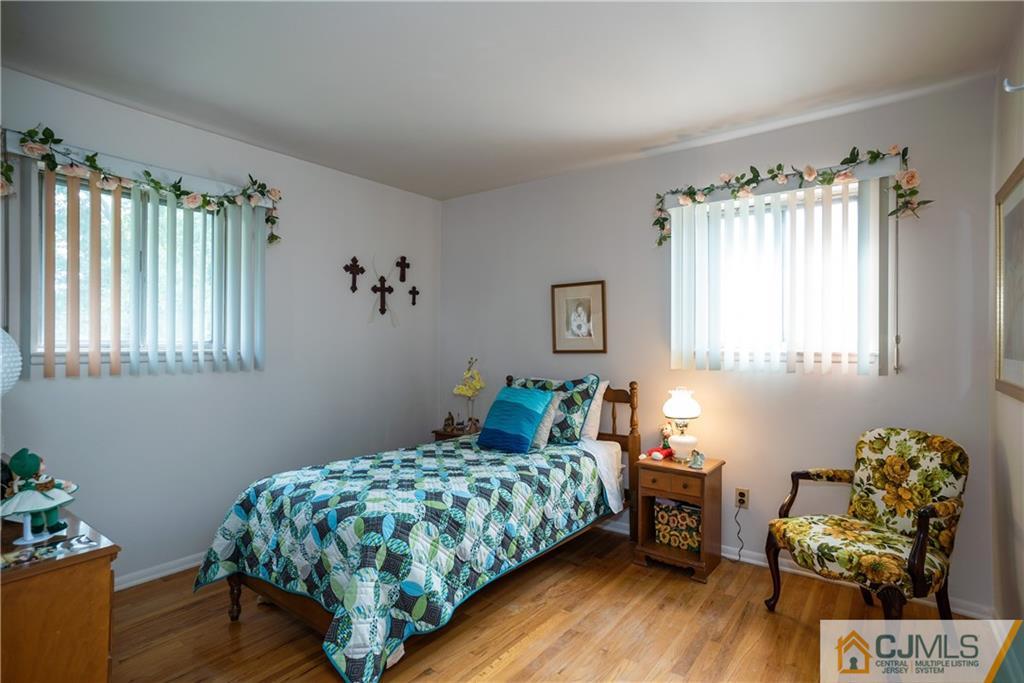 55 Gramercy Road Old Bridge, NJ 08857 - Photo 16 of 22 a bedroom with a bed and a window
