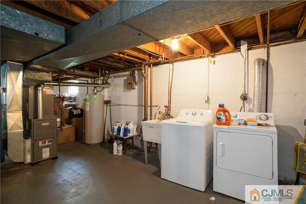 55 Gramercy Road Old Bridge, NJ 08857 - Photo 17 of 22 a view of storage and utility room with washer and dryer