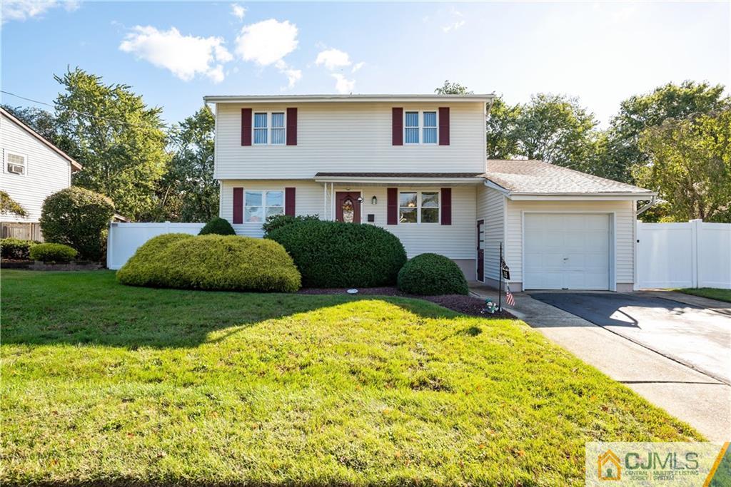 55 Gramercy Road Old Bridge, NJ 08857 - Photo 22 of 22 a front view of a house with a yard and garage