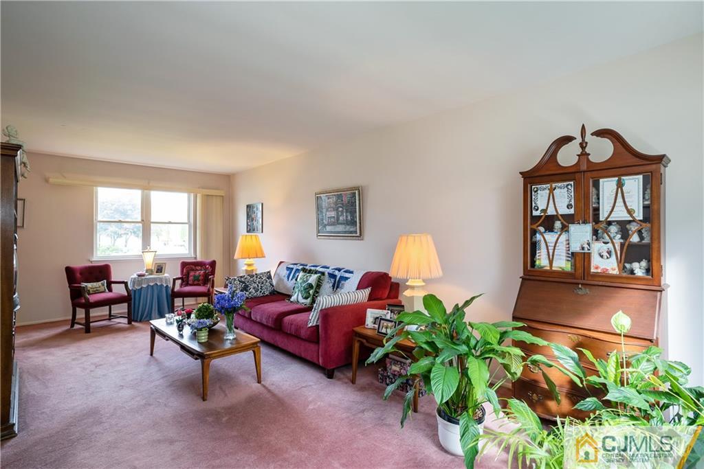 55 Gramercy Road Old Bridge, NJ 08857 - Photo 4 of 22 a living room with furniture a potted plant and a large window
