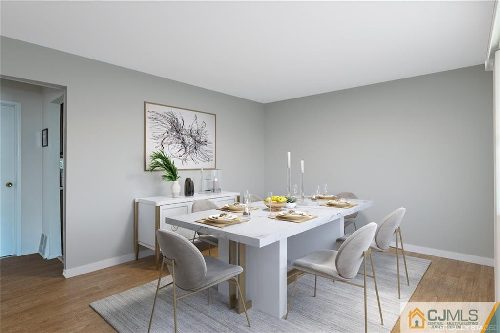 55 Gramercy Road Old Bridge, NJ 08857 - Photo 8 of 22 a view of a dining room that has a table and chairs in it