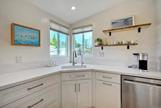 a kitchen with a sink and cabinets