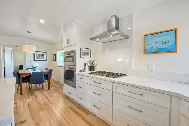 a work room with furniture and windows