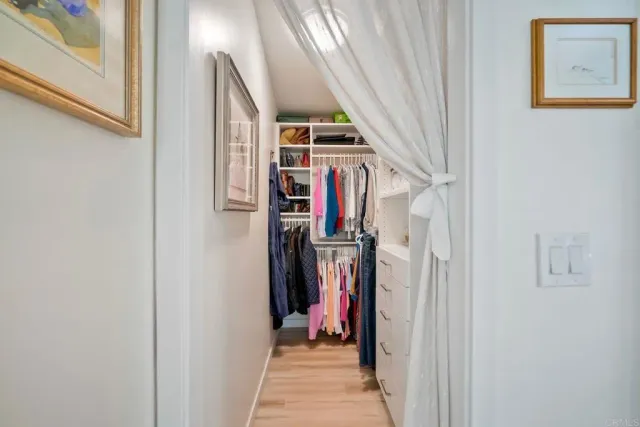 a spacious bathroom with a double vanity sink and a mirror