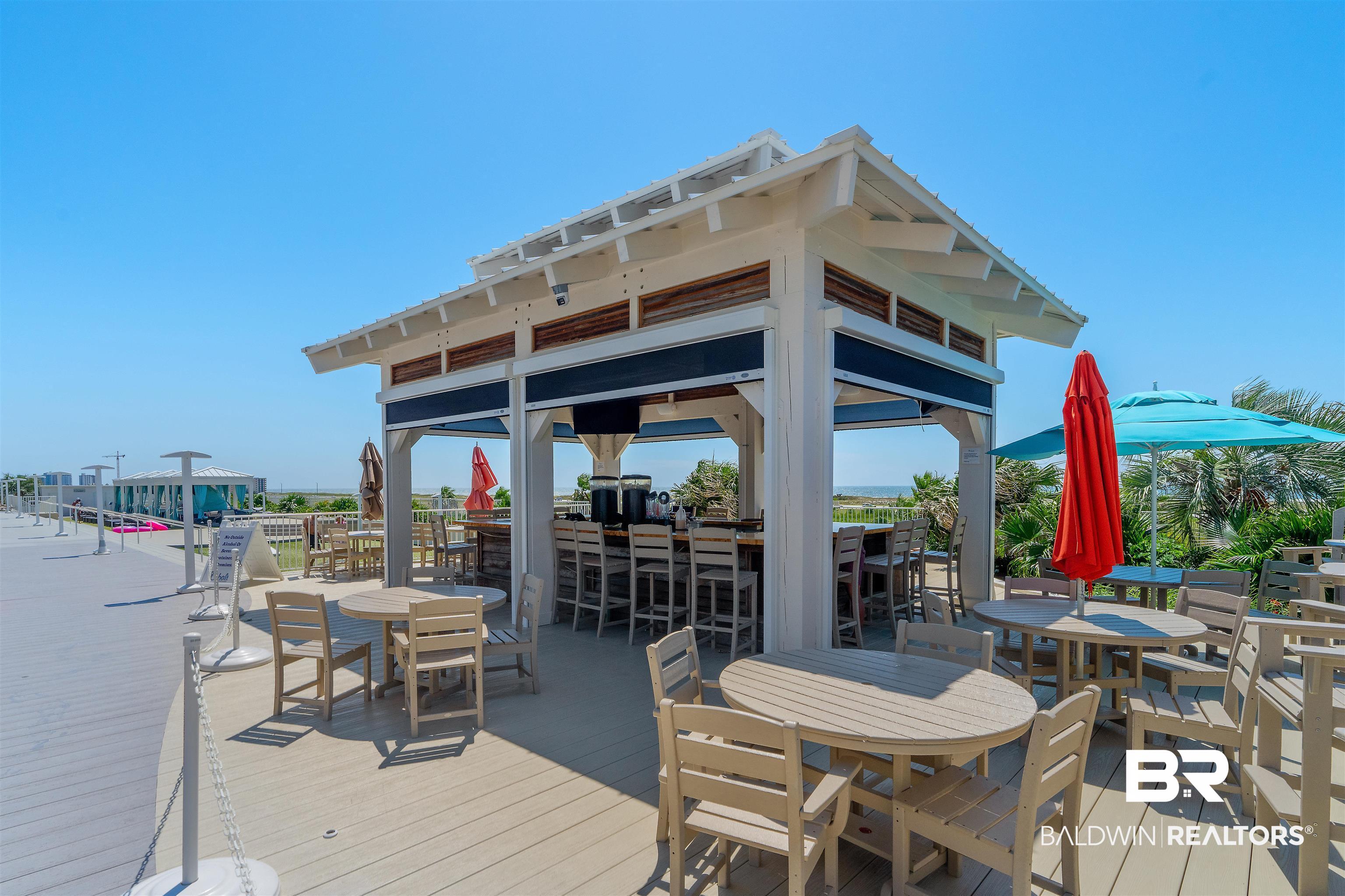 28107 Perdido Beach Boulevard, Unit DPH06 Orange Beach, AL 36561 - Photo 44 of 70 Wooden deck with exterior bar