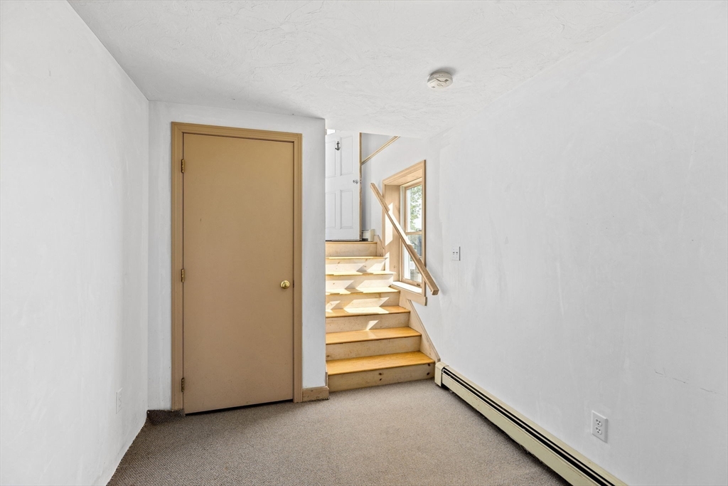 5 Silver Road Scituate, MA 02050 - Photo 20 of 30 a view of a hallway with stairs