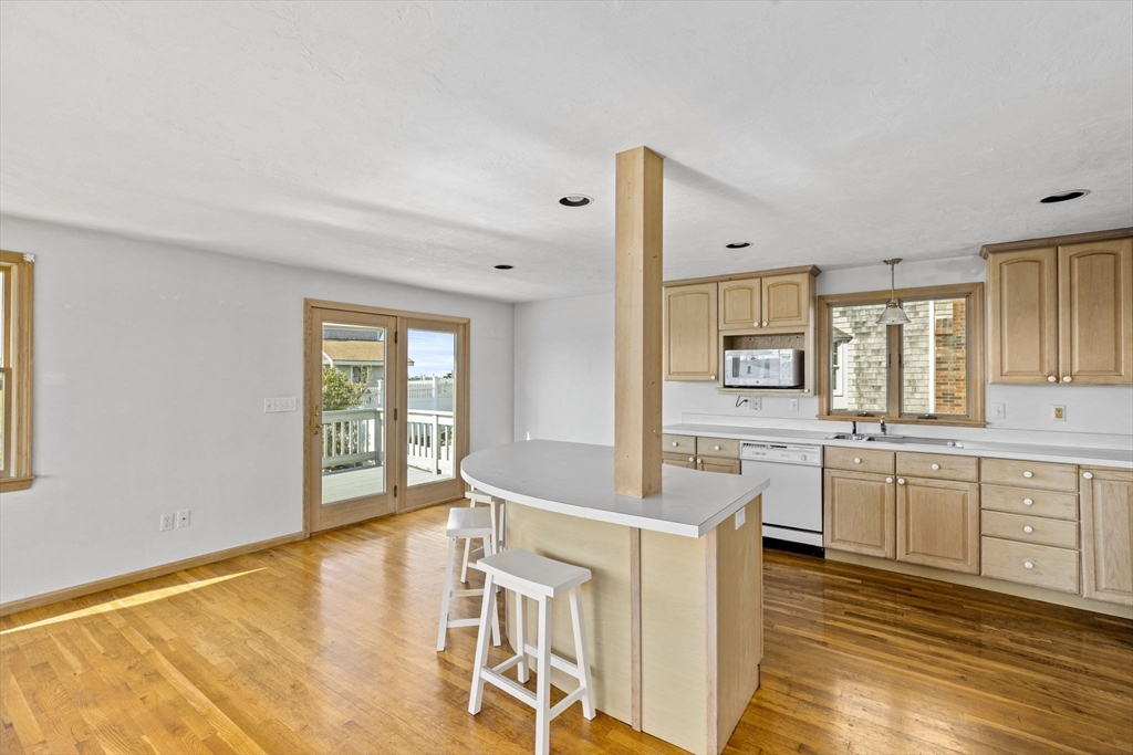5 Silver Road Scituate, MA 02050 - Photo 4 of 30 a large white kitchen with cabinets a sink and appliances