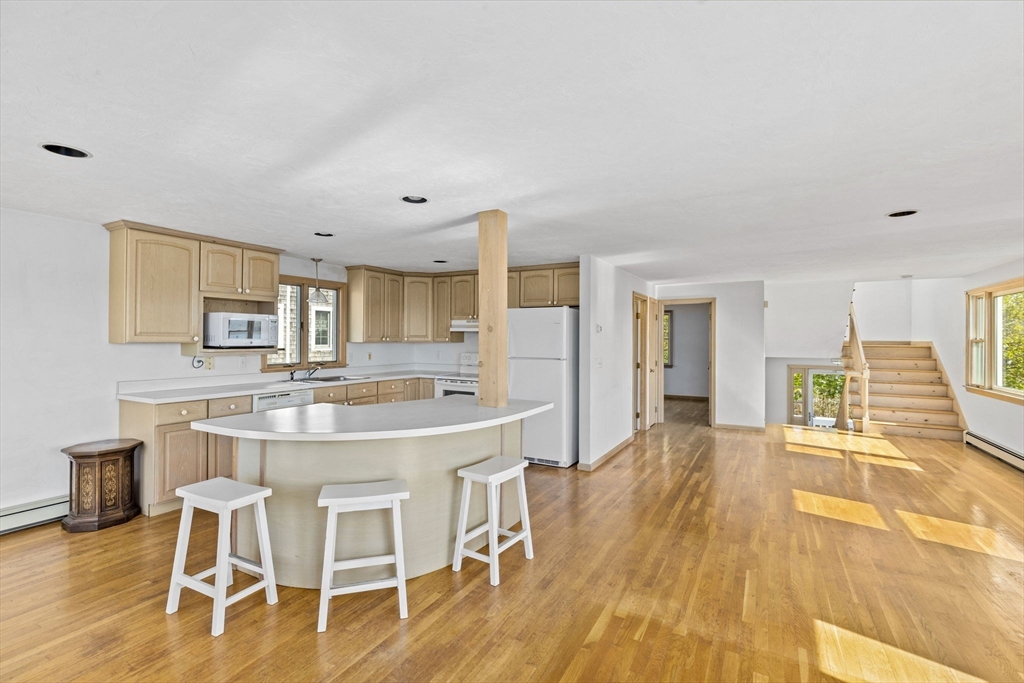 5 Silver Road Scituate, MA 02050 - Photo 6 of 30 a large kitchen with a table and chairs in it