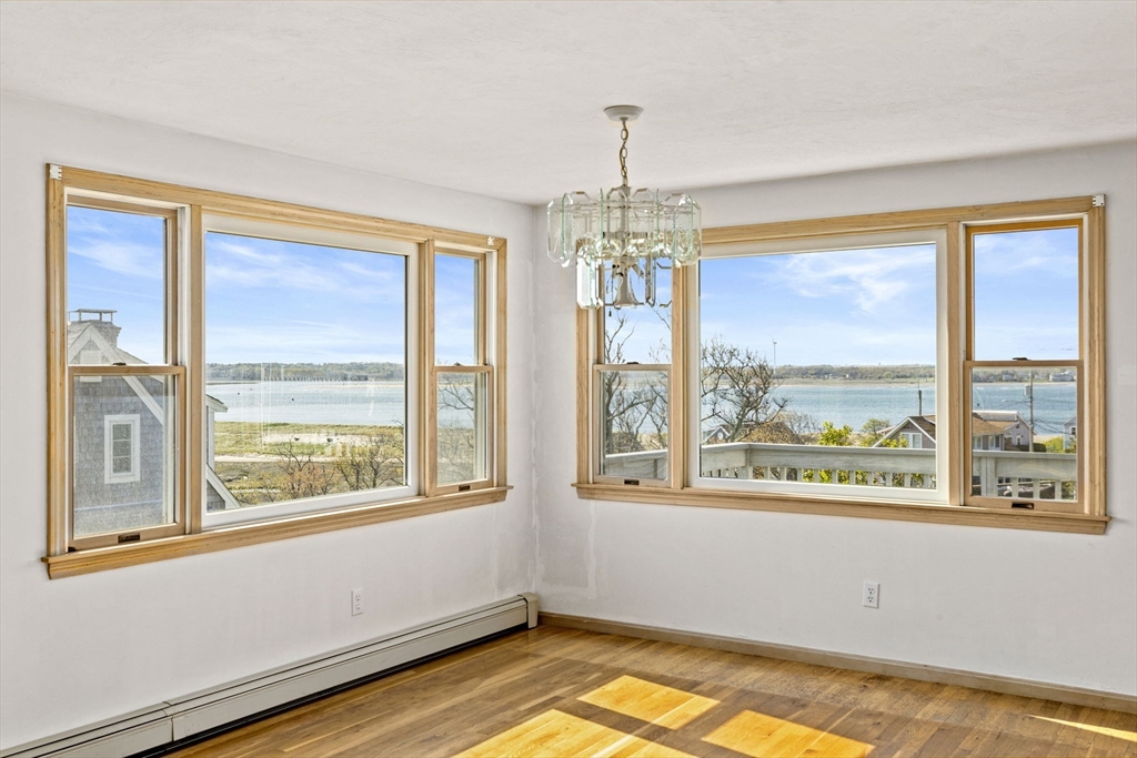 5 Silver Road Scituate, MA 02050 - Photo 10 of 30 a view of empty room with window and chandelier