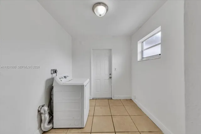 a view of an empty room and window